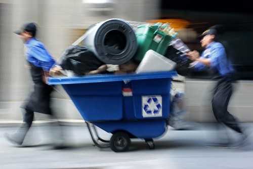 Professional waste clearance team handling construction debris